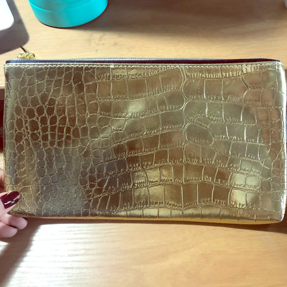 Original gold Estée Lauder clutch